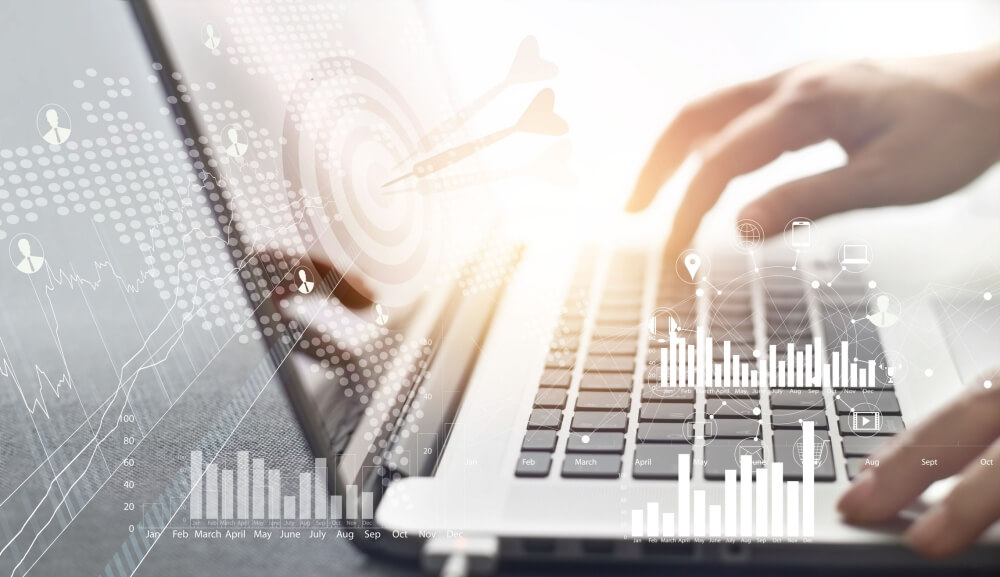 a person typing on a laptop keyboard